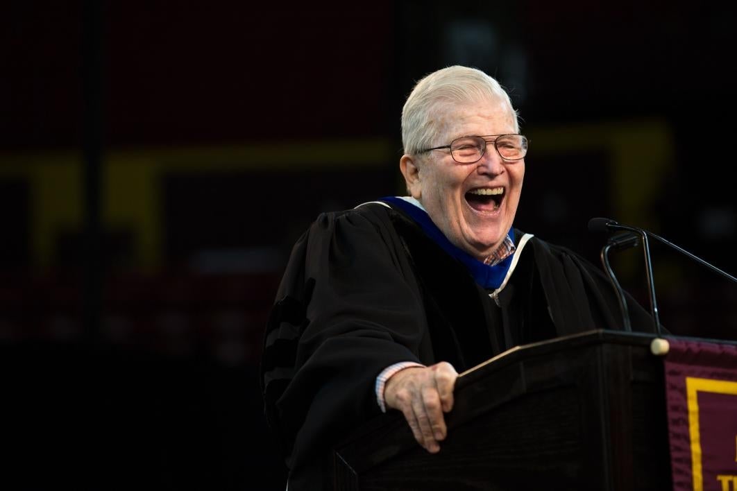 man laughing on stage