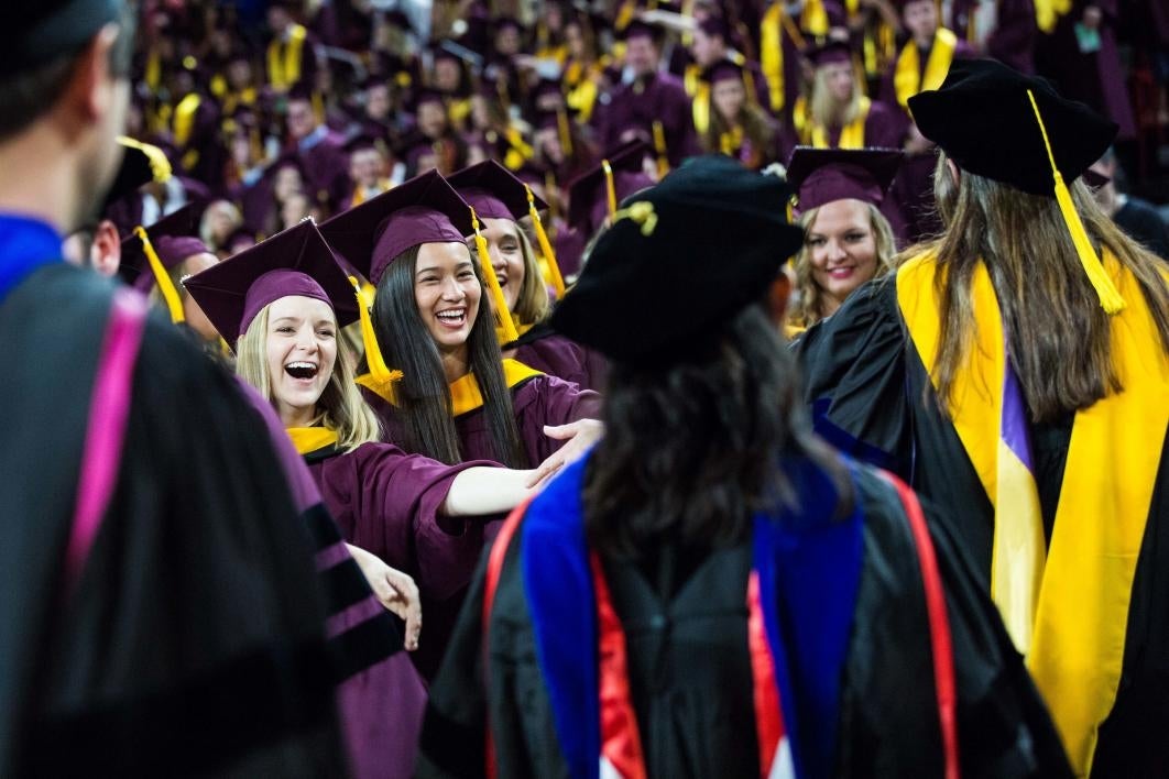 graduates greeting professors at convocation