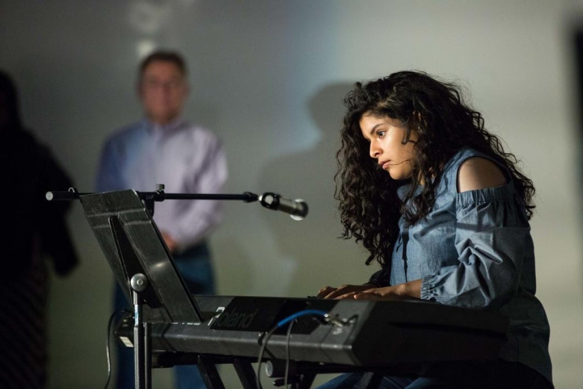 girl playing the piano