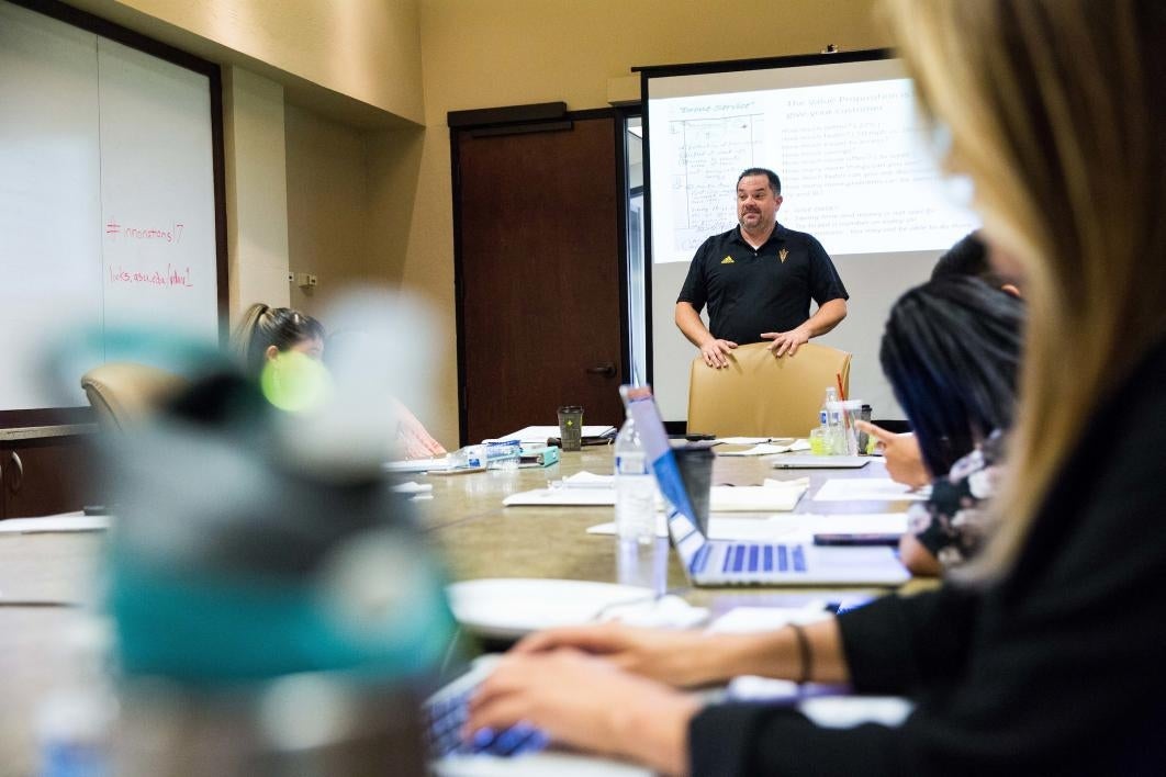 Native entrepreneurs listen during a seminar