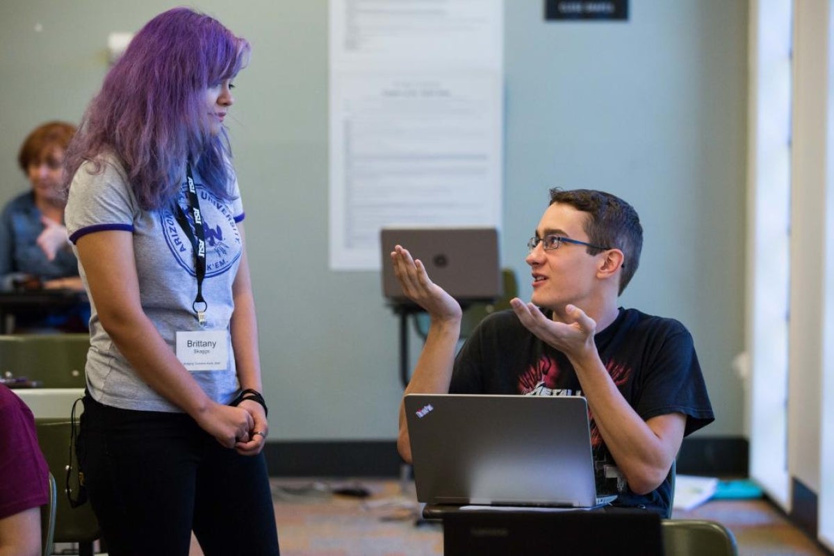 ASU Bridging Success peer mentor chats informally with new freshman