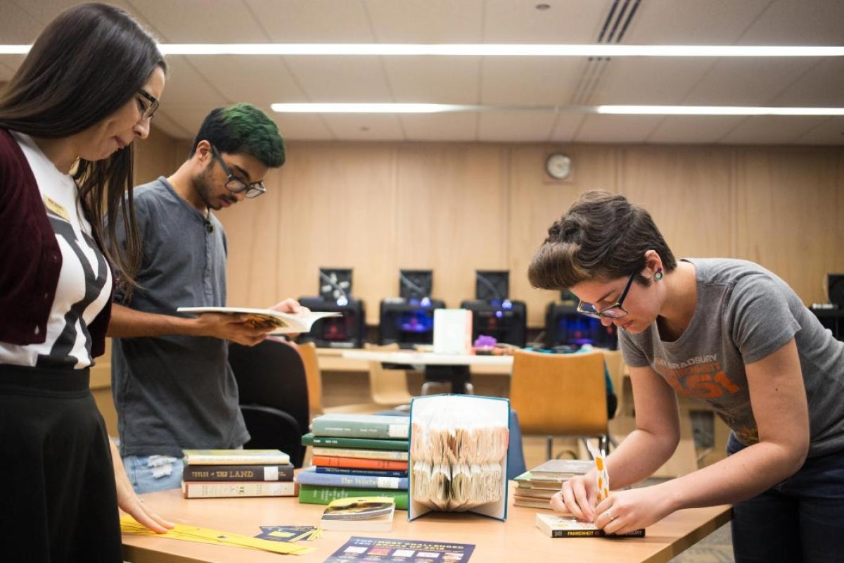 people working on book display