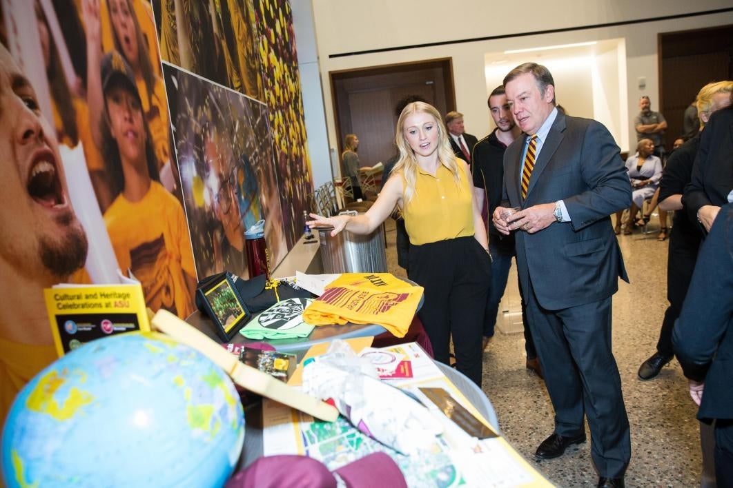 people looking at time capsule objects