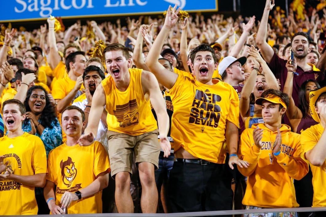 student cheering at football game