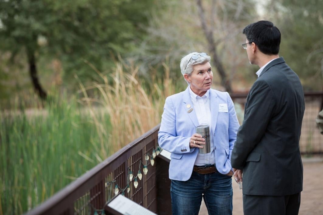 People speak on a patio