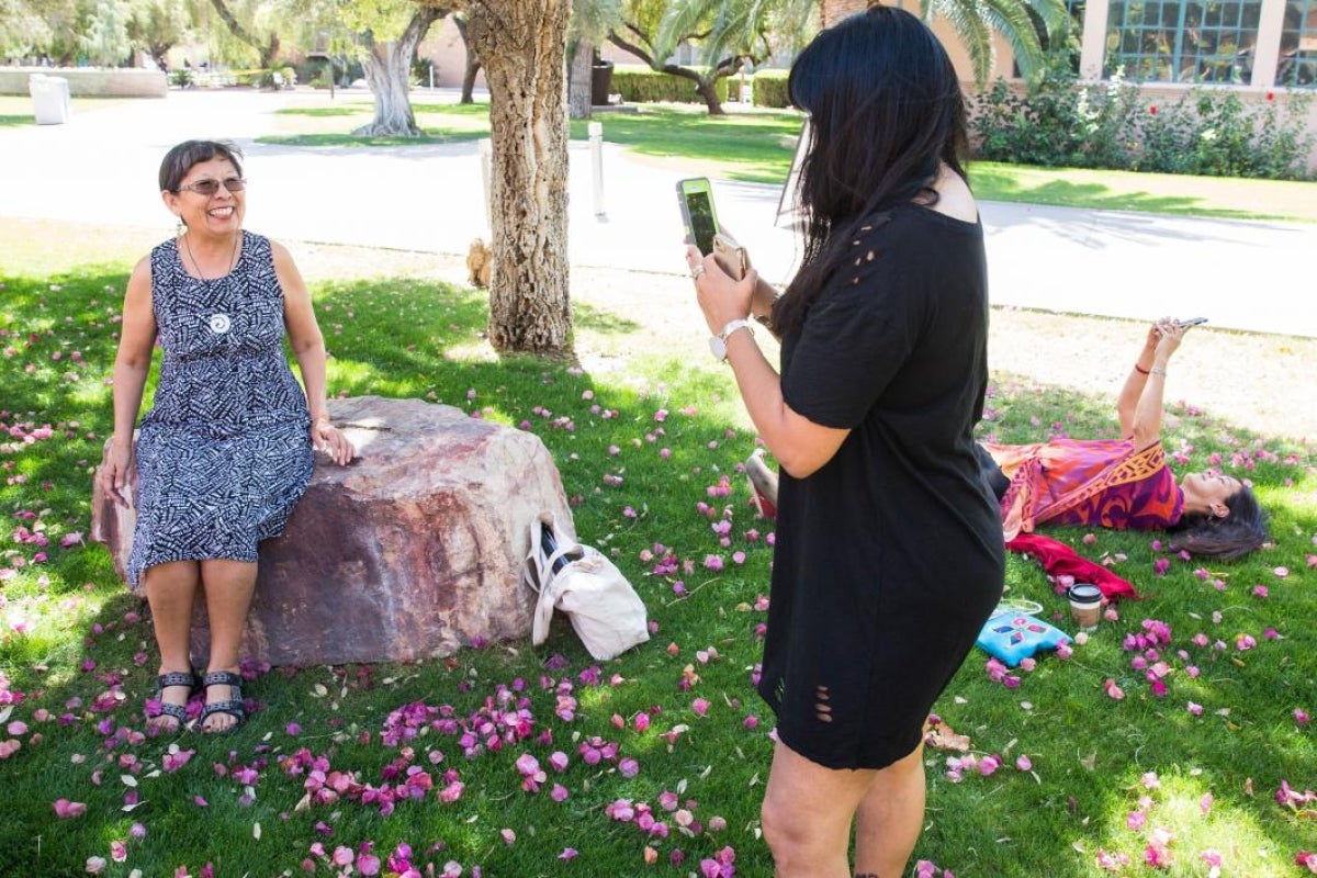 Two women taking selfies