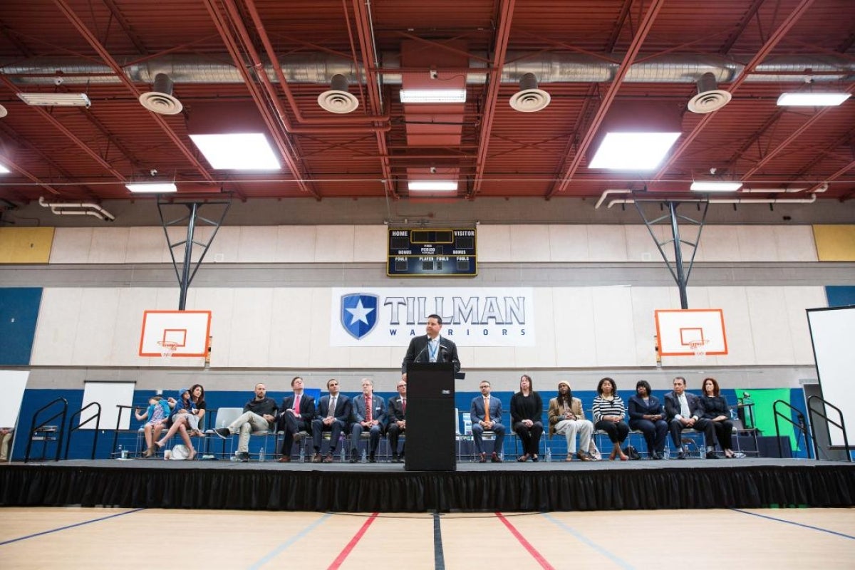 man speaking at podium