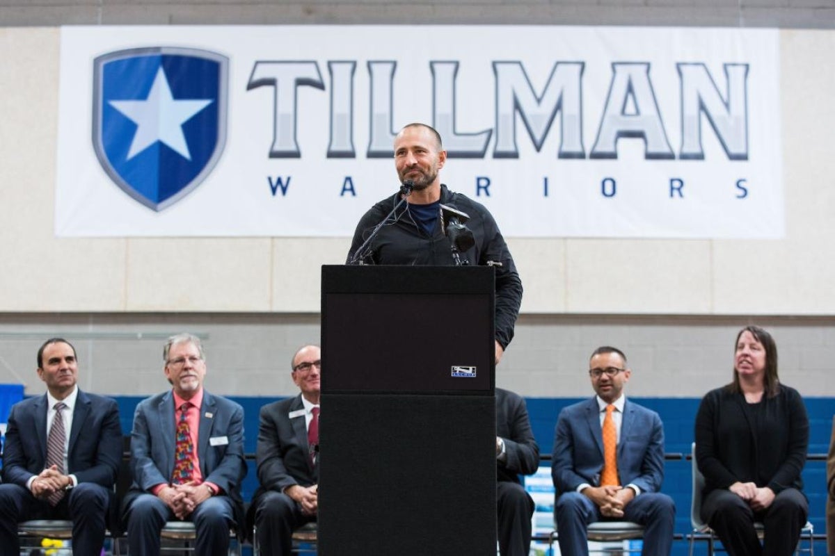 man speaking at podium