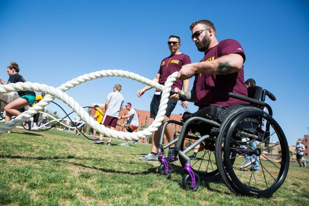 An athlete in a wheelchair does an obstacle course