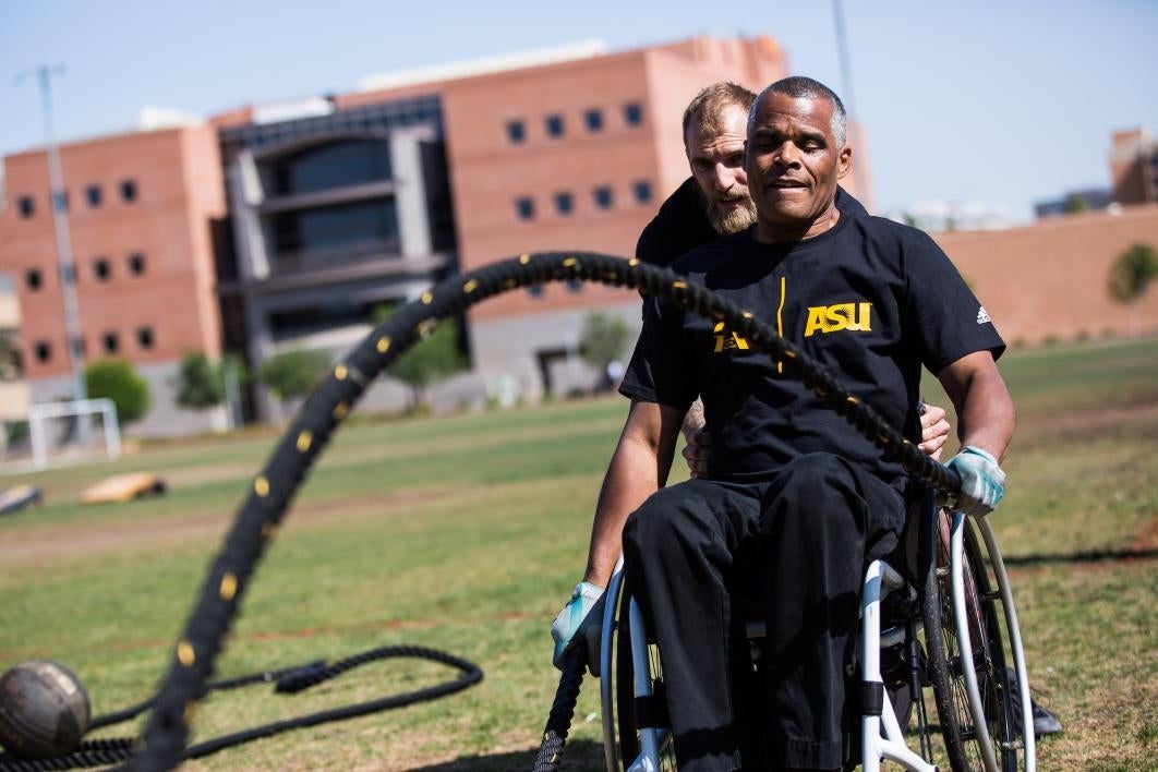 An athlete in a wheelchair does an obstacle course