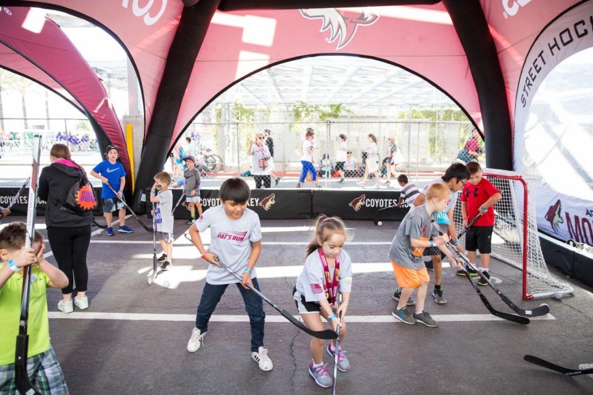 kids playing street hockey