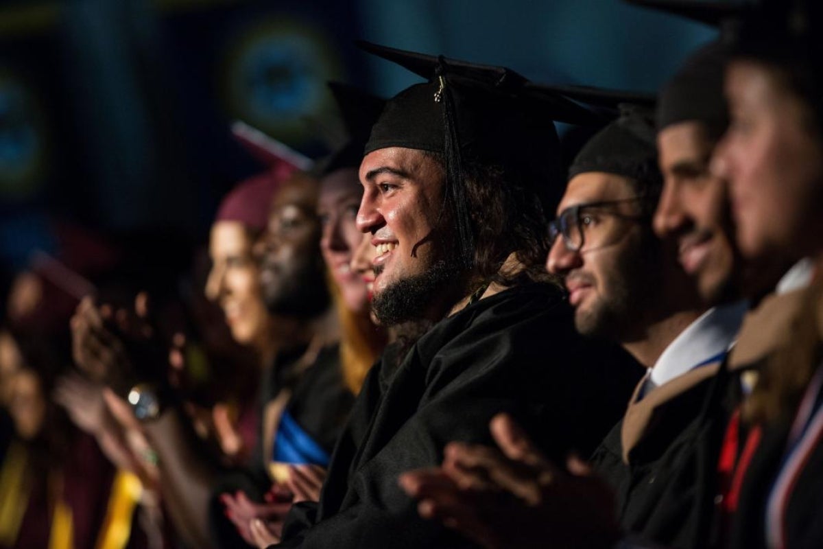 students smiling at convocation