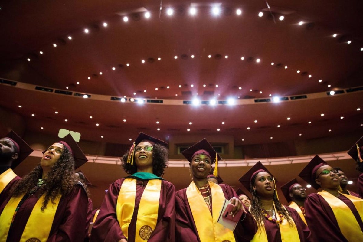 graduates standing in ASU Gammage