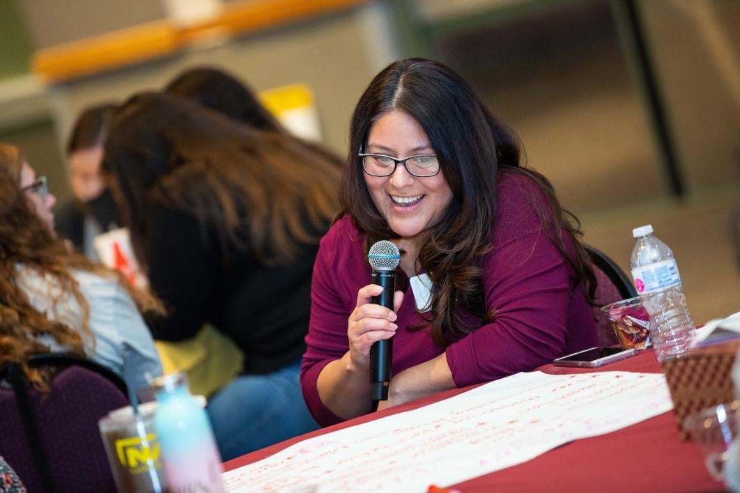 Participants at a conference on preventing domestic violence share their ideas