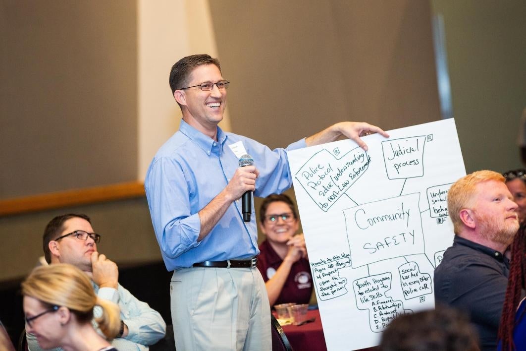 Participants at a conference on preventing domestic violence share their ideas