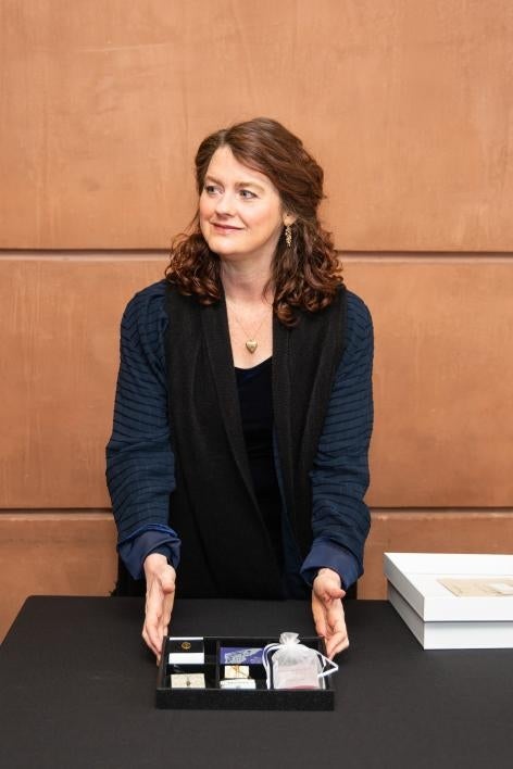 Kelly Houle shows a collection of her miniature artist's books. / Photo by Deanna Dent/ASU Now