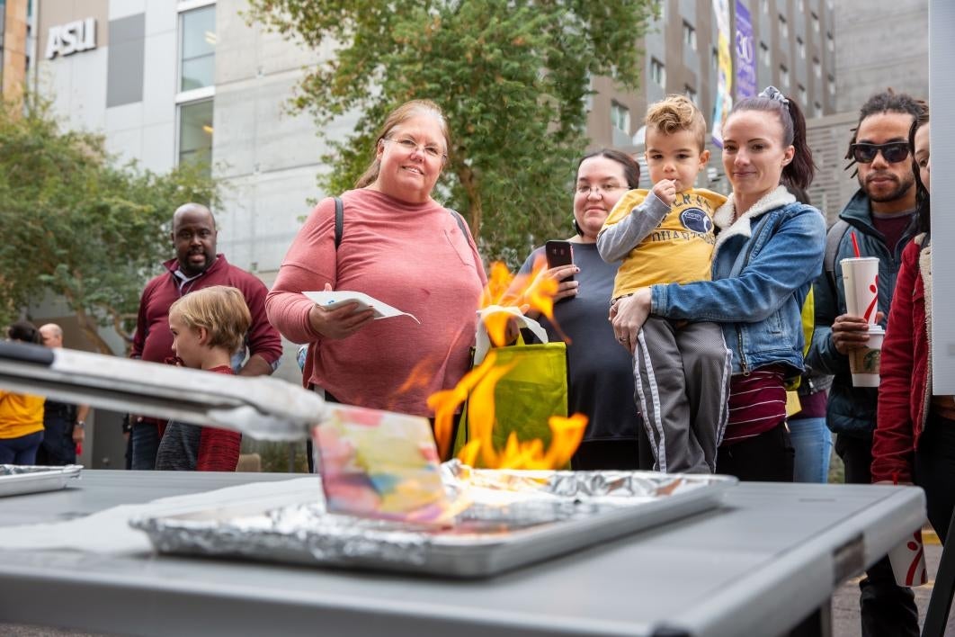 people watch a tile craft