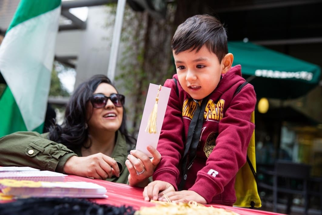 kid looking at a bookmark