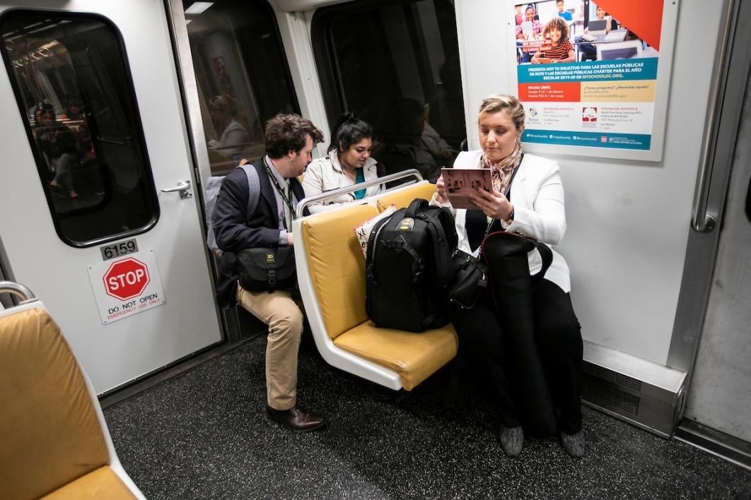 Three people sitting down