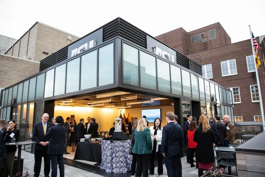 People standing outside on a rooftop