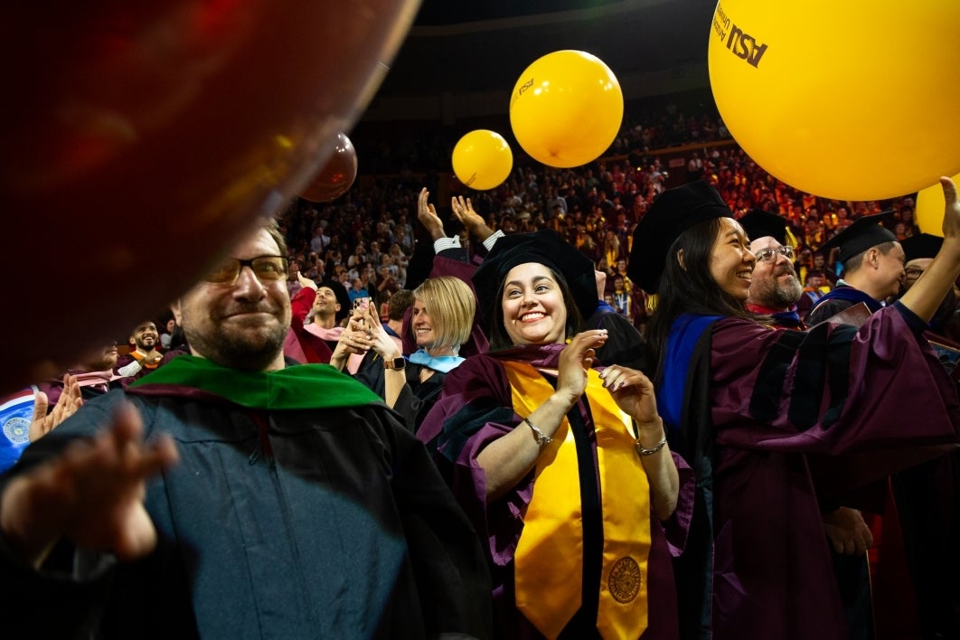 graduates celebrate