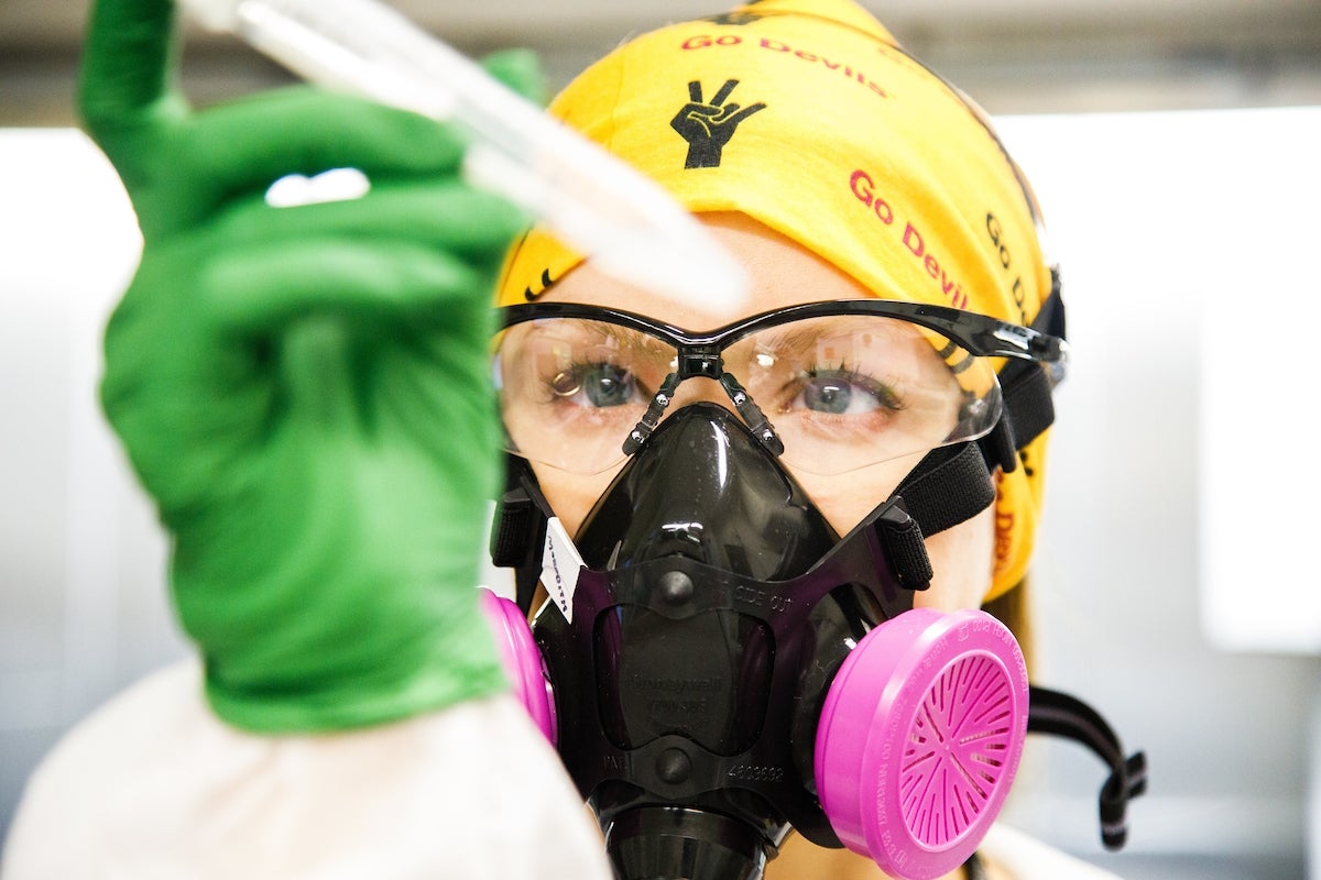 Researchers in the ASU Biodesign Clinical Testing Lab, or ABCTL, work with COVID-19 tests in the robotic COVID-19 testing lab on April 30th, 2020.