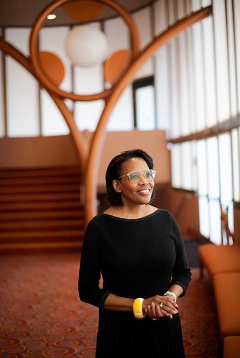 Woman poses inside ASU Gammage theater lobby