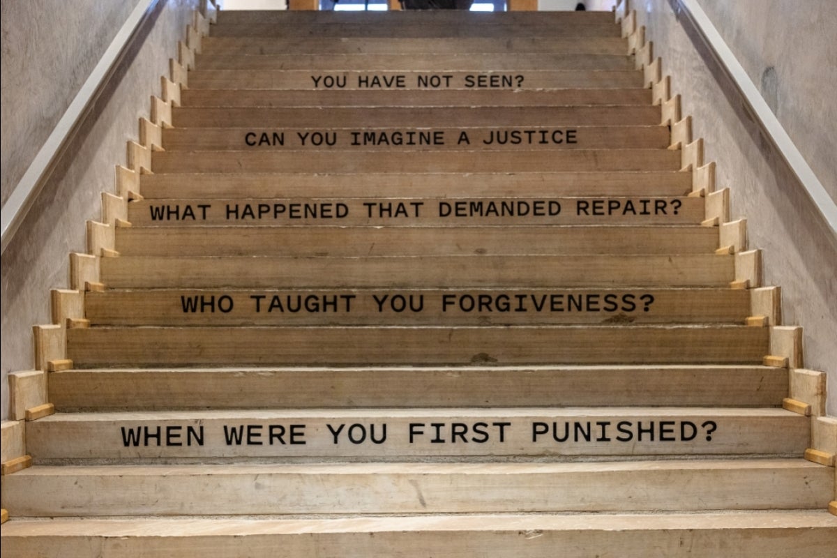 Phrases about incarceration painted on stairs