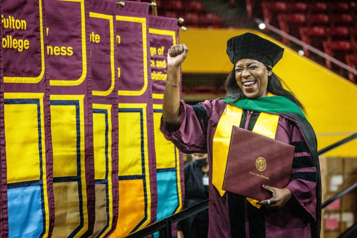 woman celebrating at Graduate Commencement