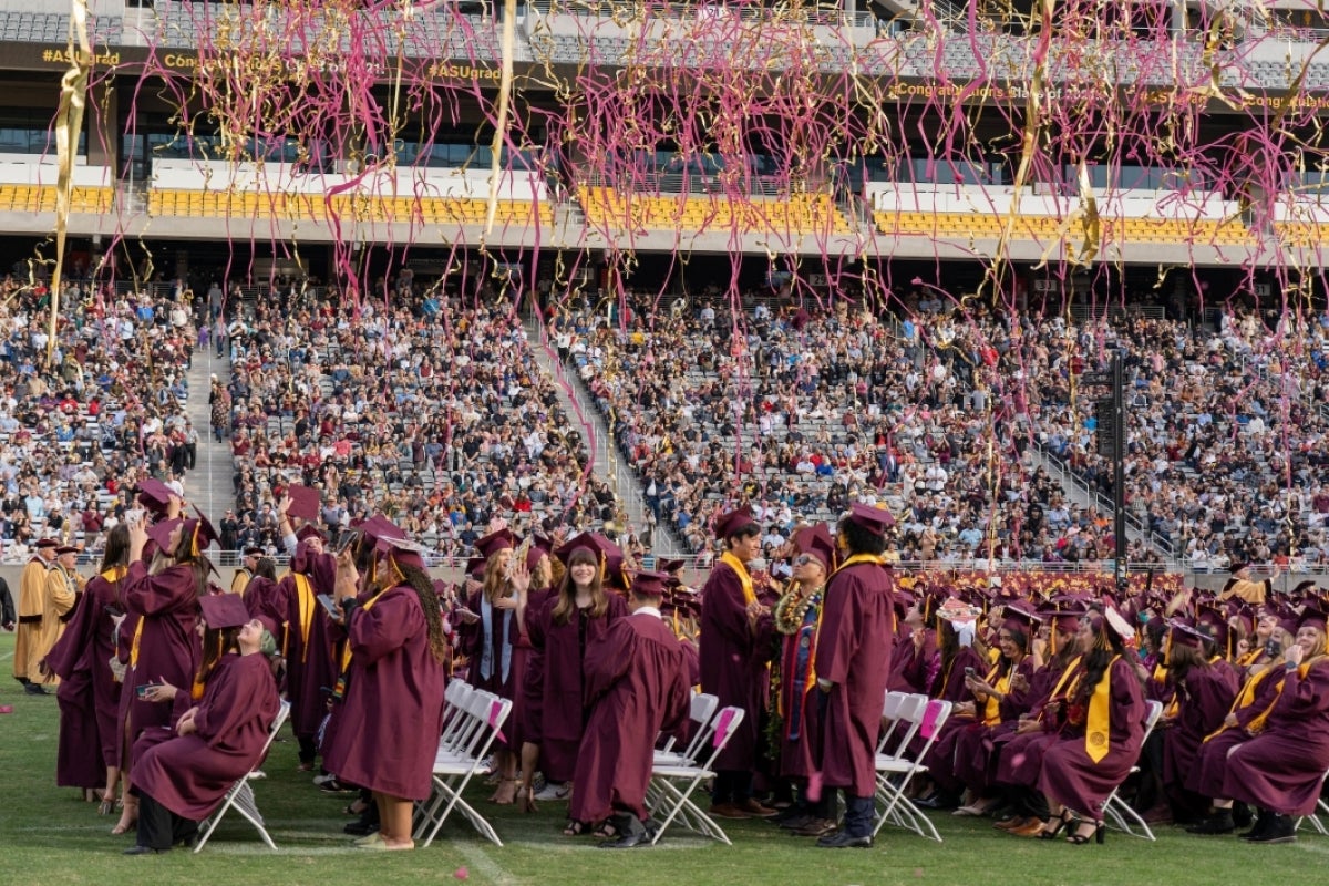 confetti and streamers falling on crowd at graduation