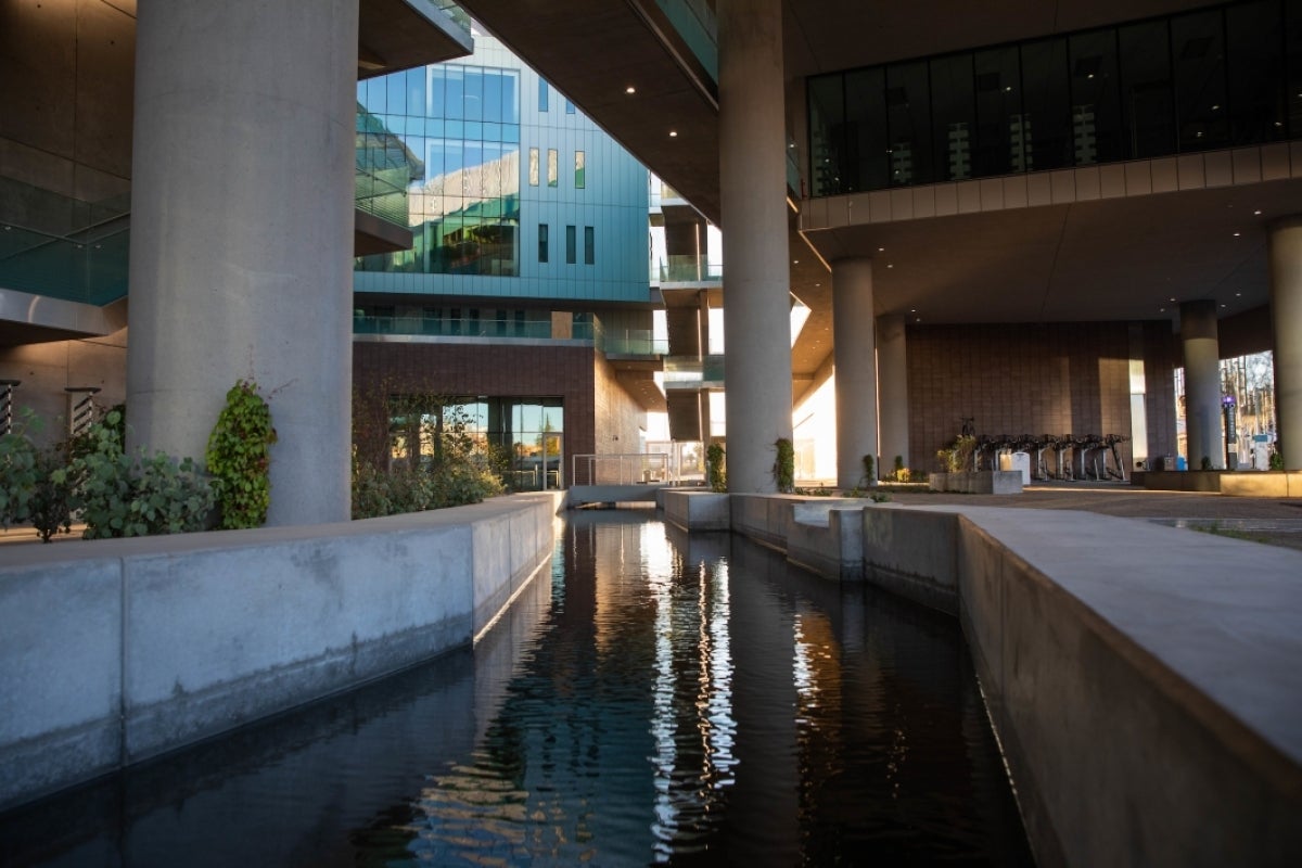 water running through canal in building courtyard