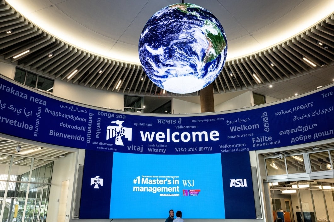 Round rotunda with electronic signage and a digital globe