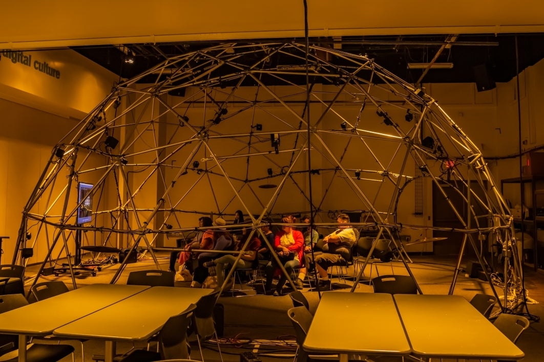 Group of people under an ambisonic dome