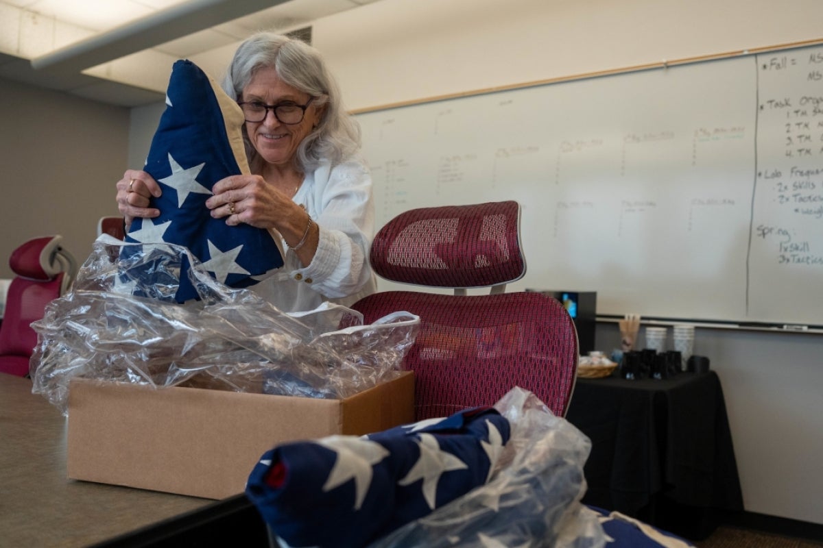 Woman unboxing US flags