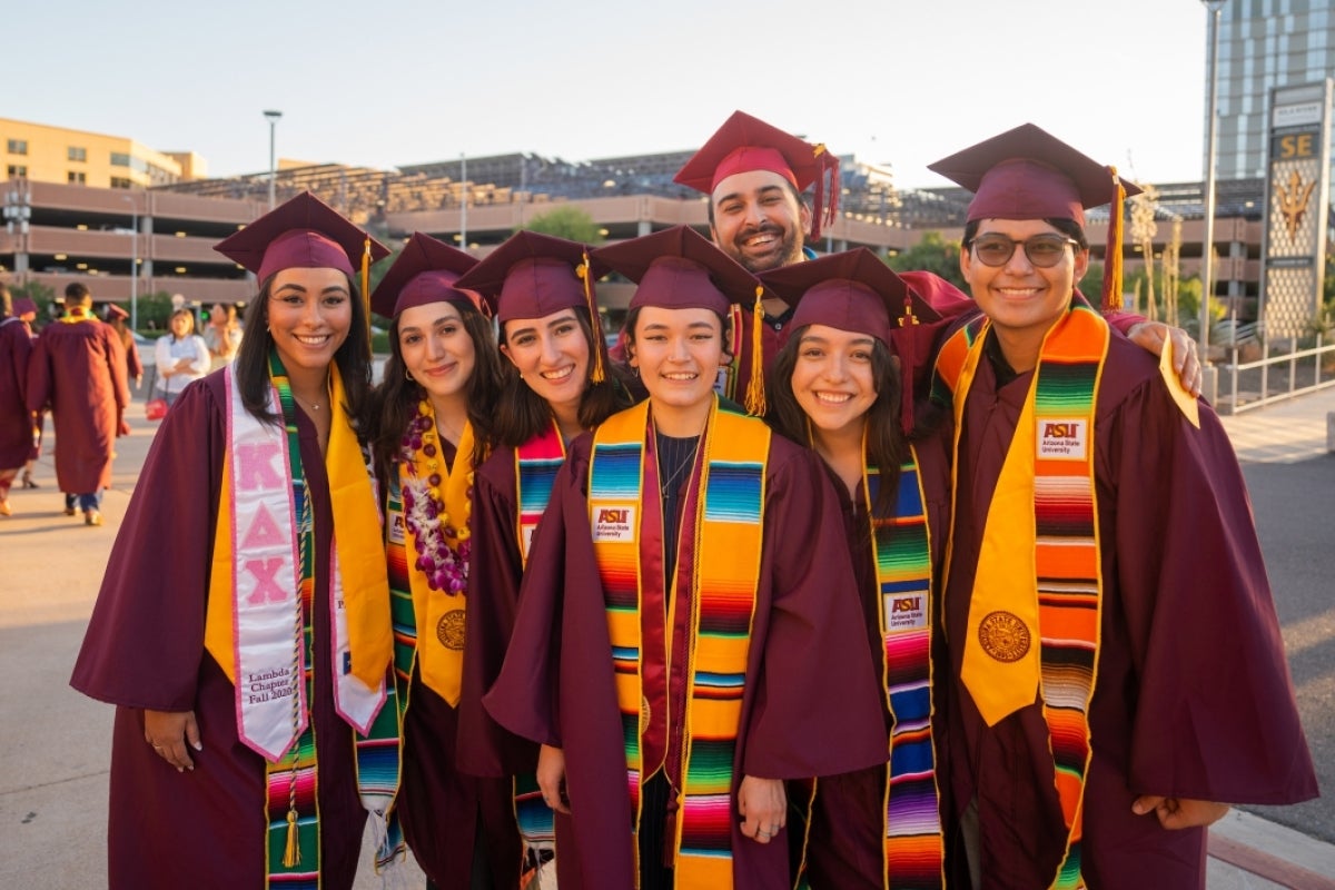 Group of graduates posing outside before convocation