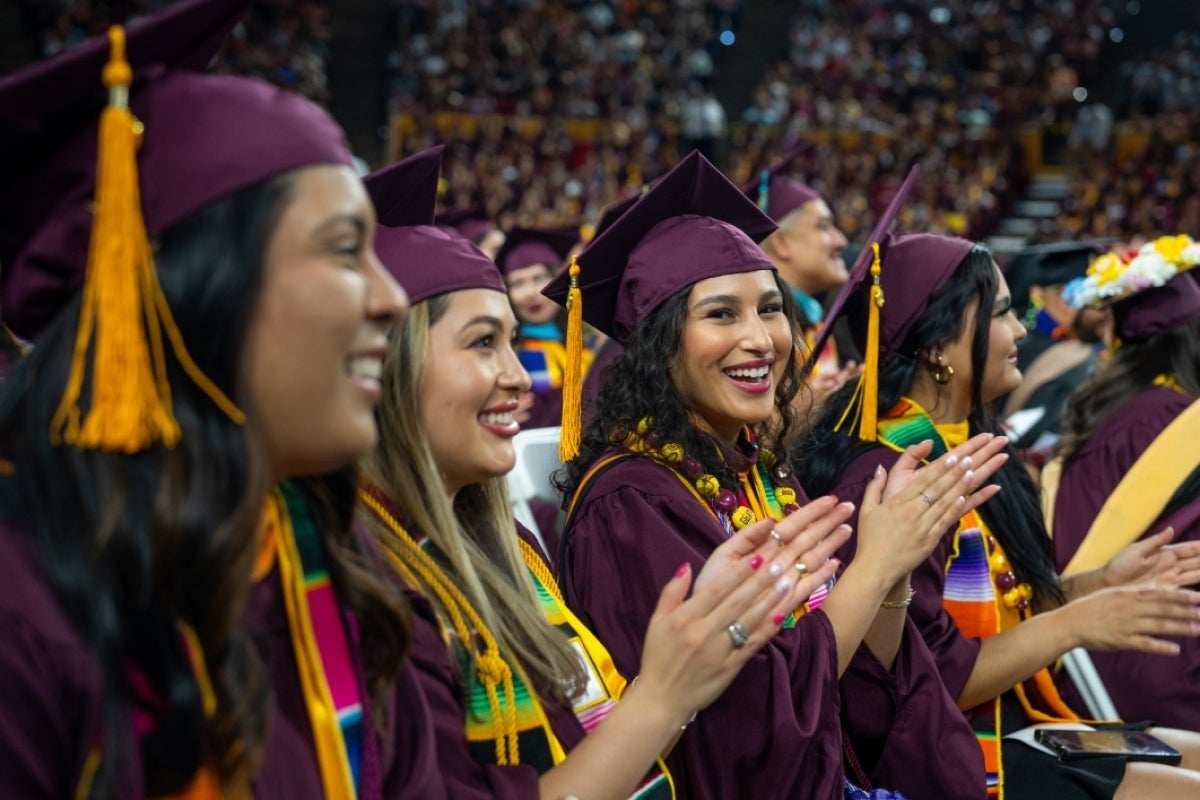 Graduates clapping during convocation