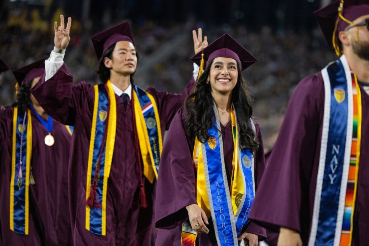 Veteran grads walking to seats during convocation