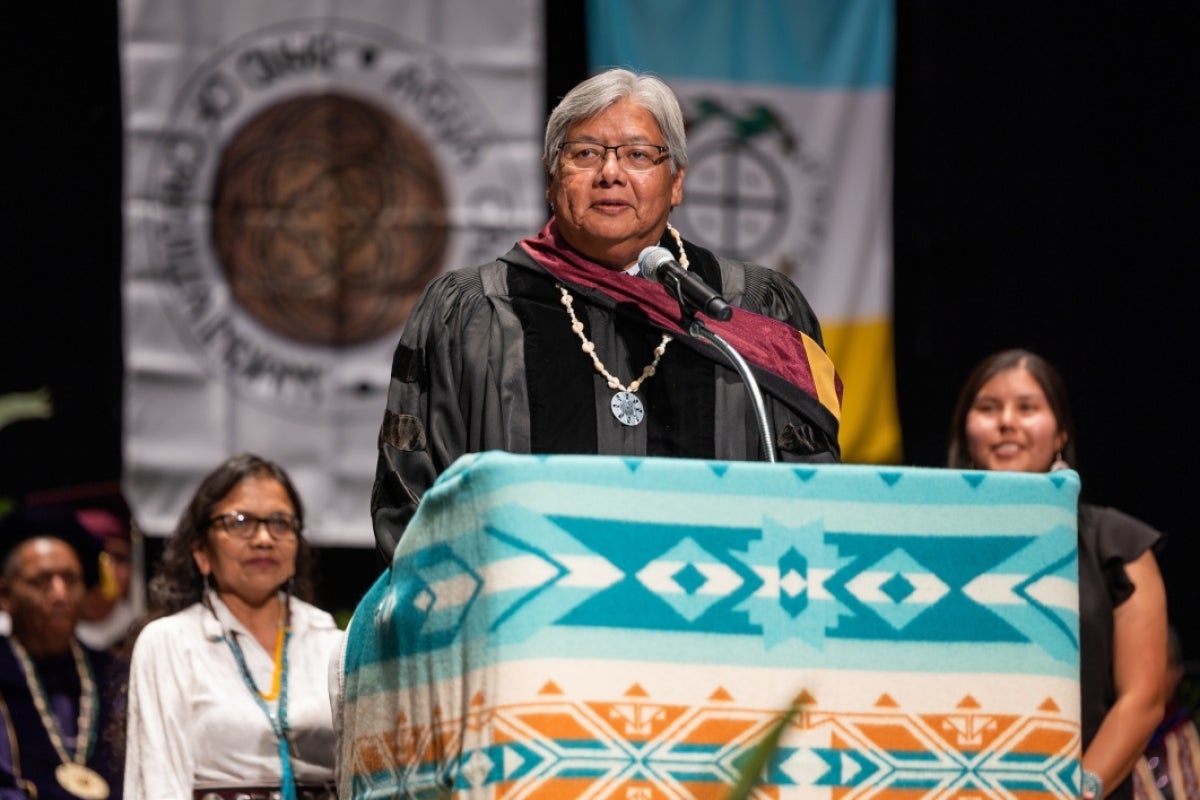 Man speaking at lectern during convocation