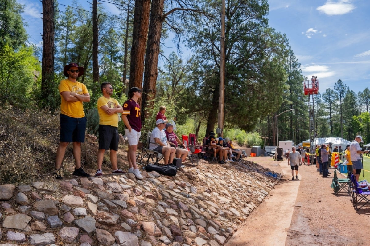 People stand near trees