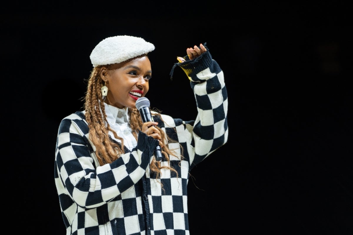 Singer Janelle Monae looks out at crowd at speaking event