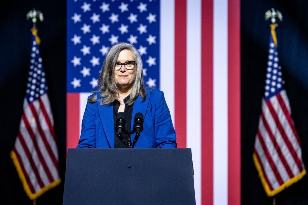 Arizona Gov. Katie Hobbs stands at a lectern