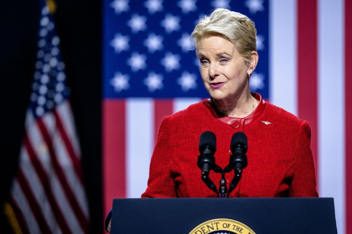 Ambassador Cindy McCain speaks from a lectern