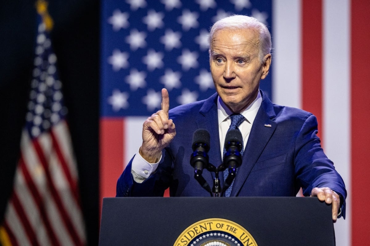 President Joe Biden speaks at a lectern