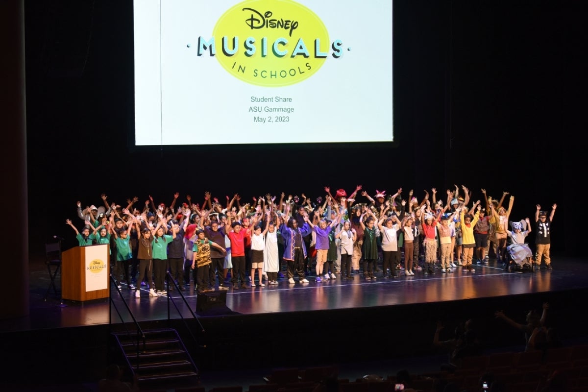 Children perform on stage.