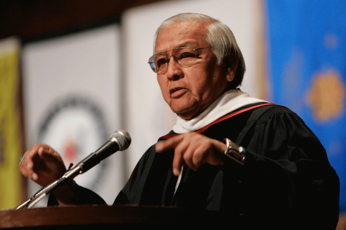 Man speaking at lectern at commencement