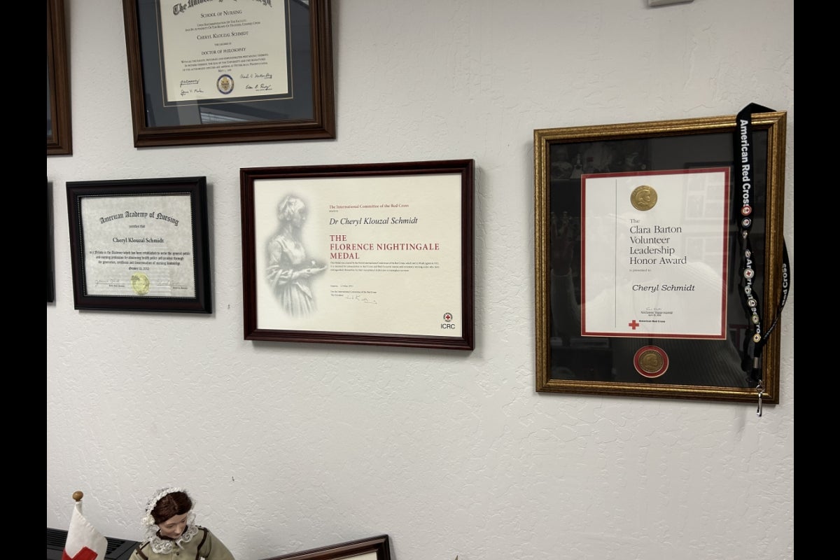 Awards framed on a wall.