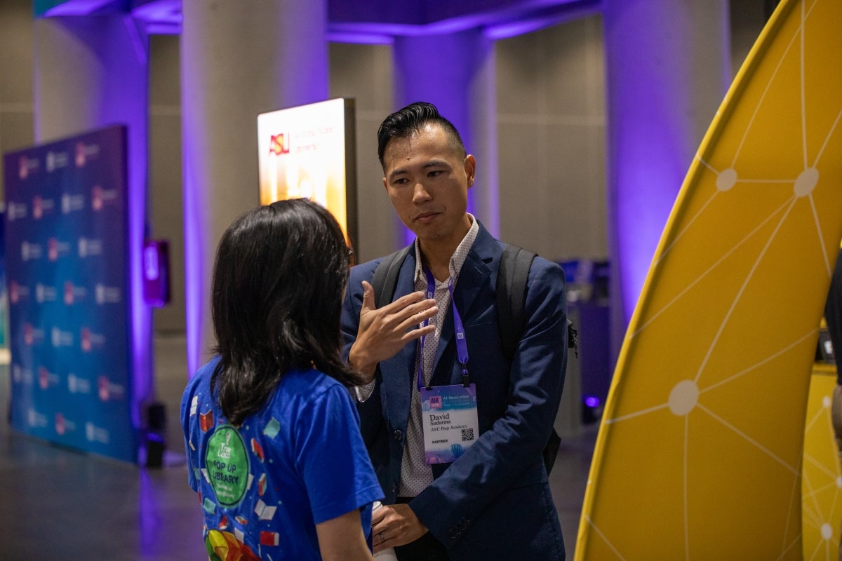 Two people interacting at convention event