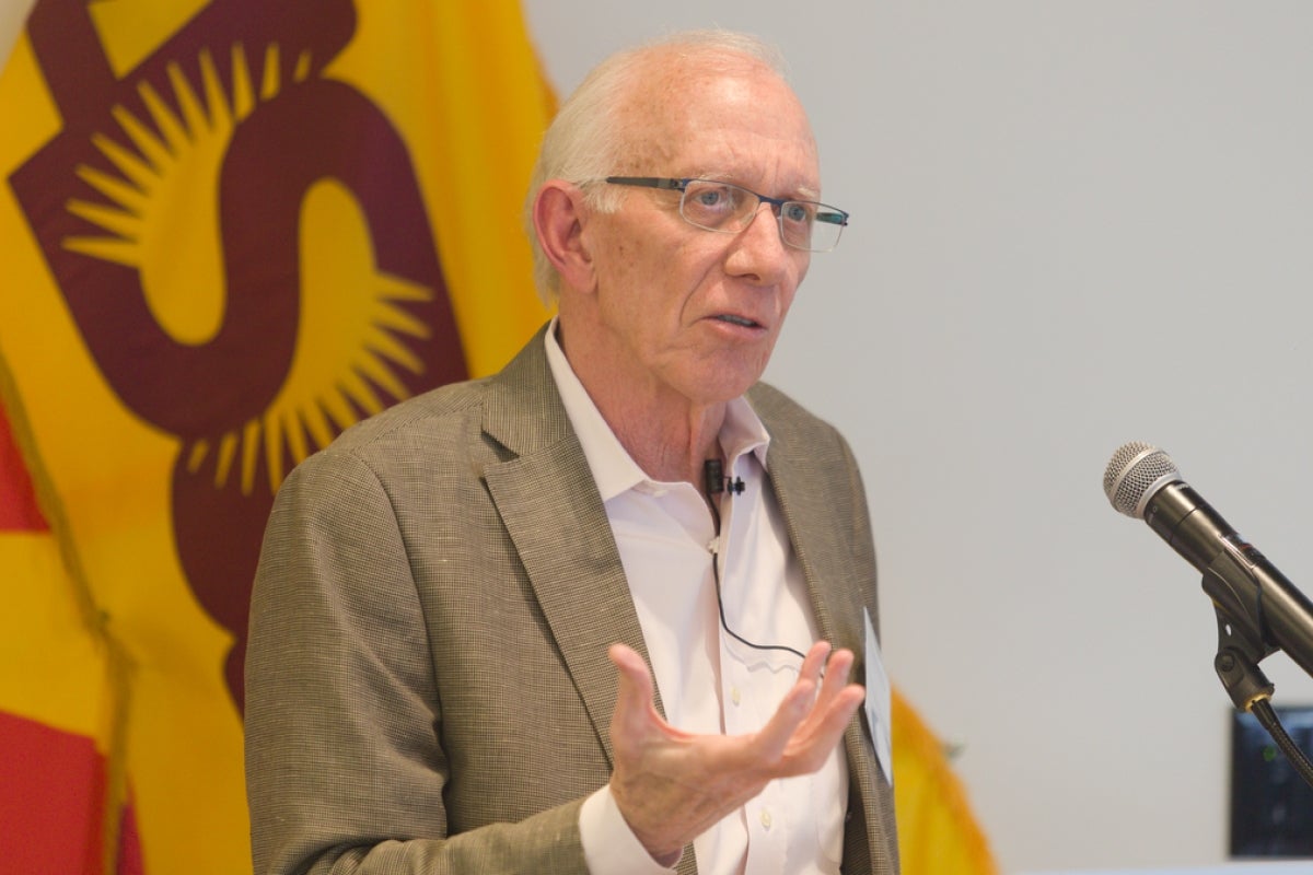 Robert Schmidle speaking at a lectern