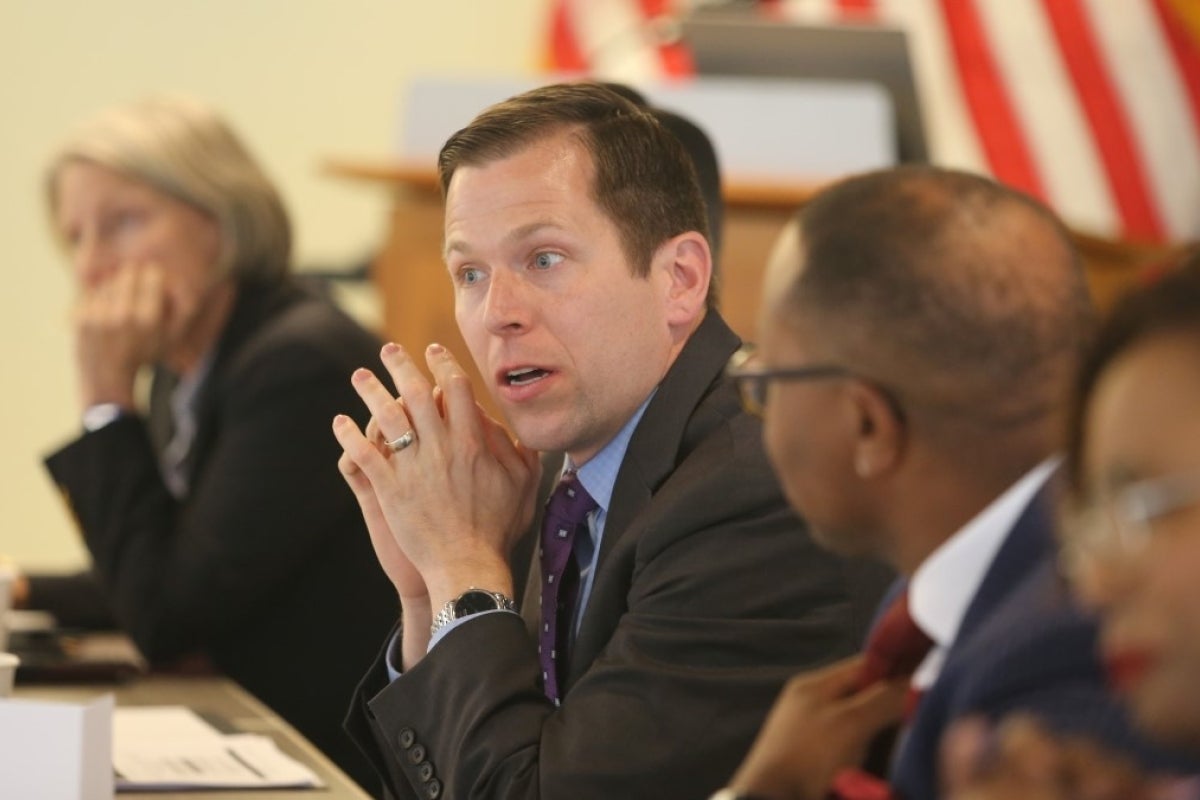 Dave Kaiser sits at a table with others