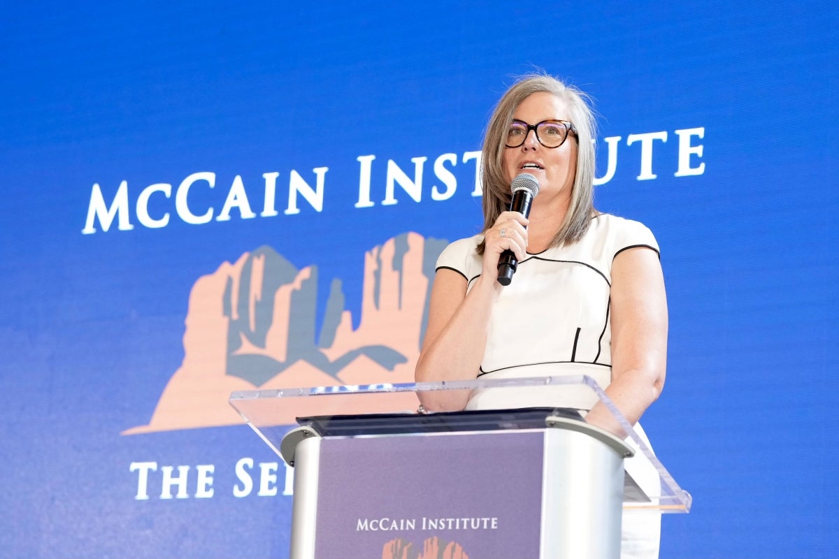 Arizona Gov. Katie Hobbs speaking behind lectern